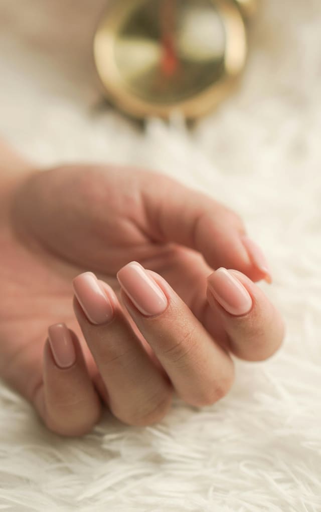 Natural nails in a soft pink gel finish